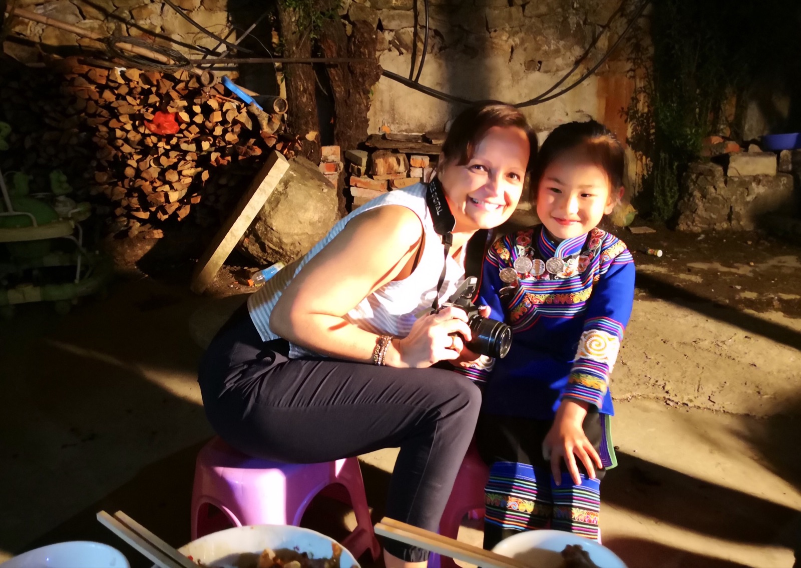An international guest spending time with a local family in the village